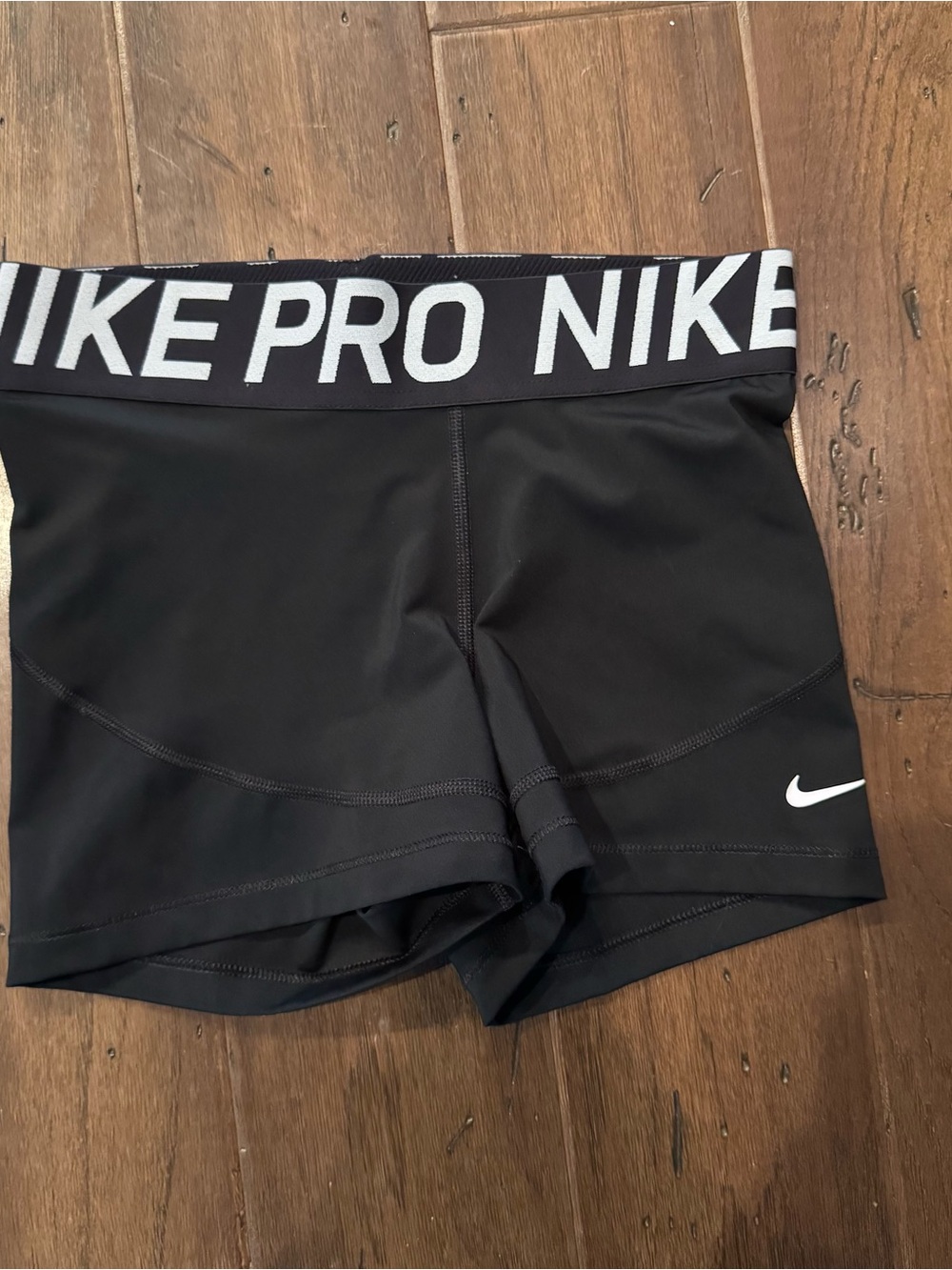 Nike Black Athletic Compression Shorts with White Swoosh